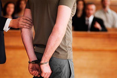 man in handcuffs in court man in handcuffs in court