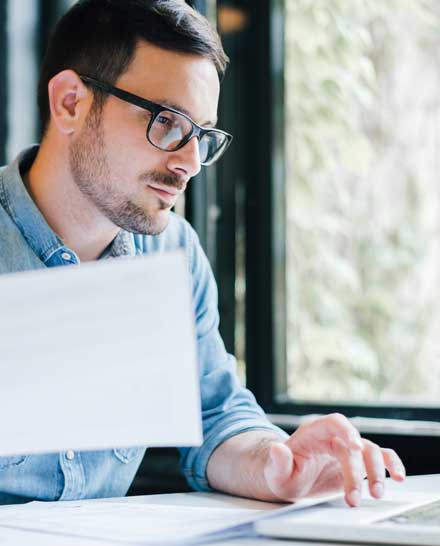 Man Using the Laptop — Weston, WV — John E Law CPA, A.C. Man Using the Laptop — Weston, WV — John E Law CPA, A.C.