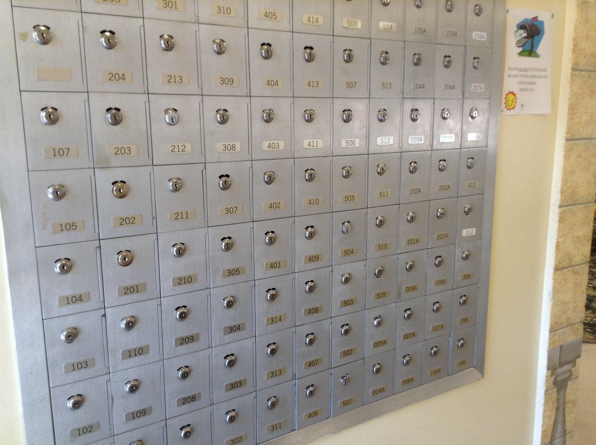 Metal mailboxes with numbered doors.