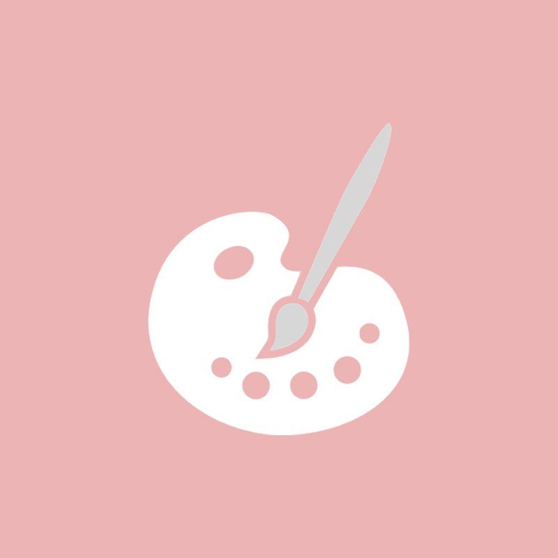 Una paleta blanca con un pincel sobre un fondo rosa.