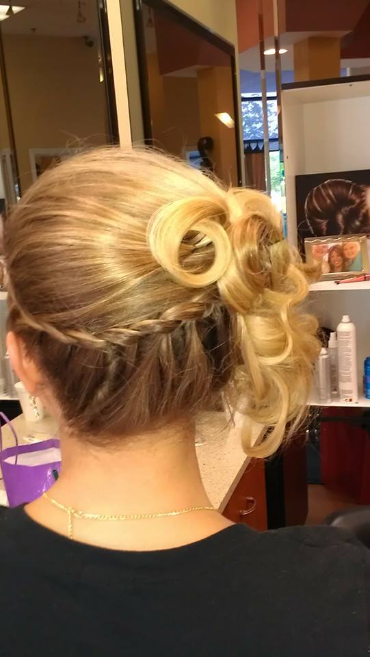 A woman is getting her hair done in a salon.
