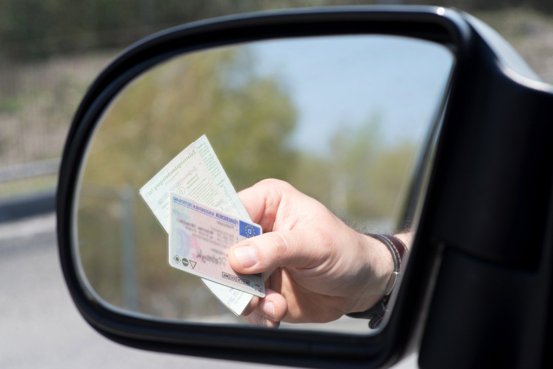 Man Shows Driver's License — Allen, TX — Newton Buckley, CPA Man Shows Driver's License — Allen, TX — Newton Buckley, CPA