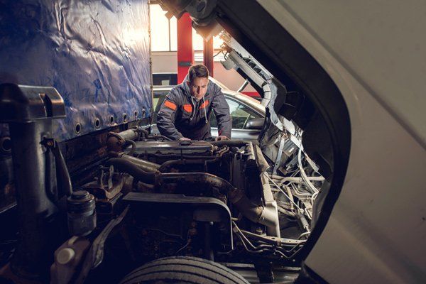 man working on service truck