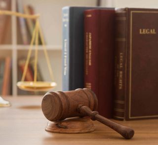 Wooden Gavel And Pile of Books — Santa Paula, CA — Romney Law Offices APC