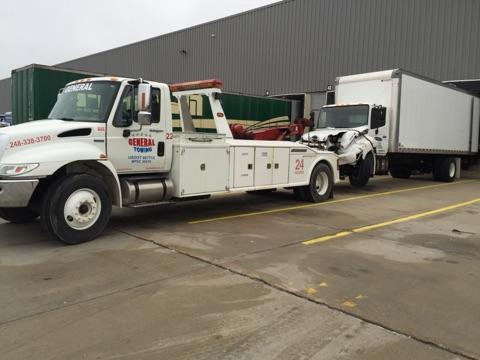 Van Loaded Onto Towing Truck — Auburn Hills, MI — General Towing Auburn Hills Van Loaded Onto Towing Truck — Auburn Hills, MI — General Towing Auburn Hills