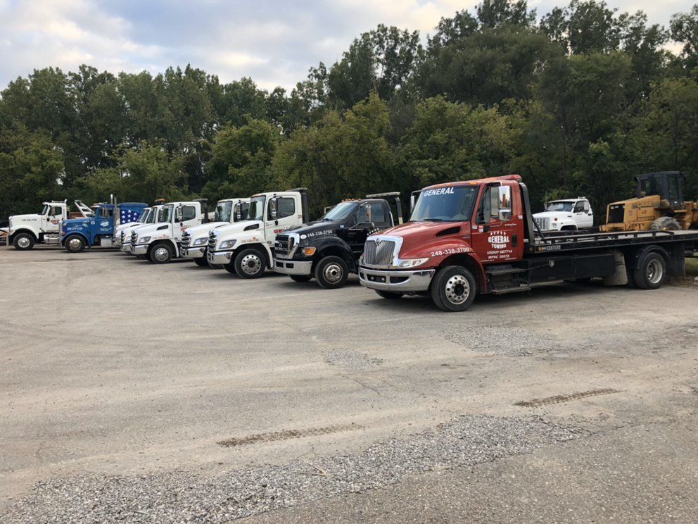 Tow Truck Towing Two Vehicles — Auburn Hills, MI — General Towing Auburn Hills Tow Truck Towing Two Vehicles — Auburn Hills, MI — General Towing Auburn Hills