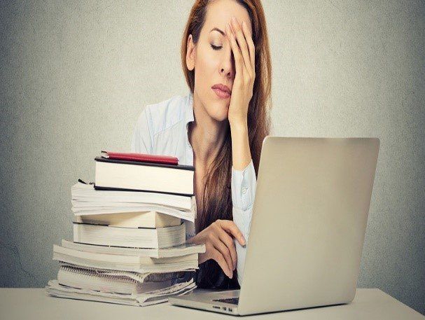 lady with pile of books