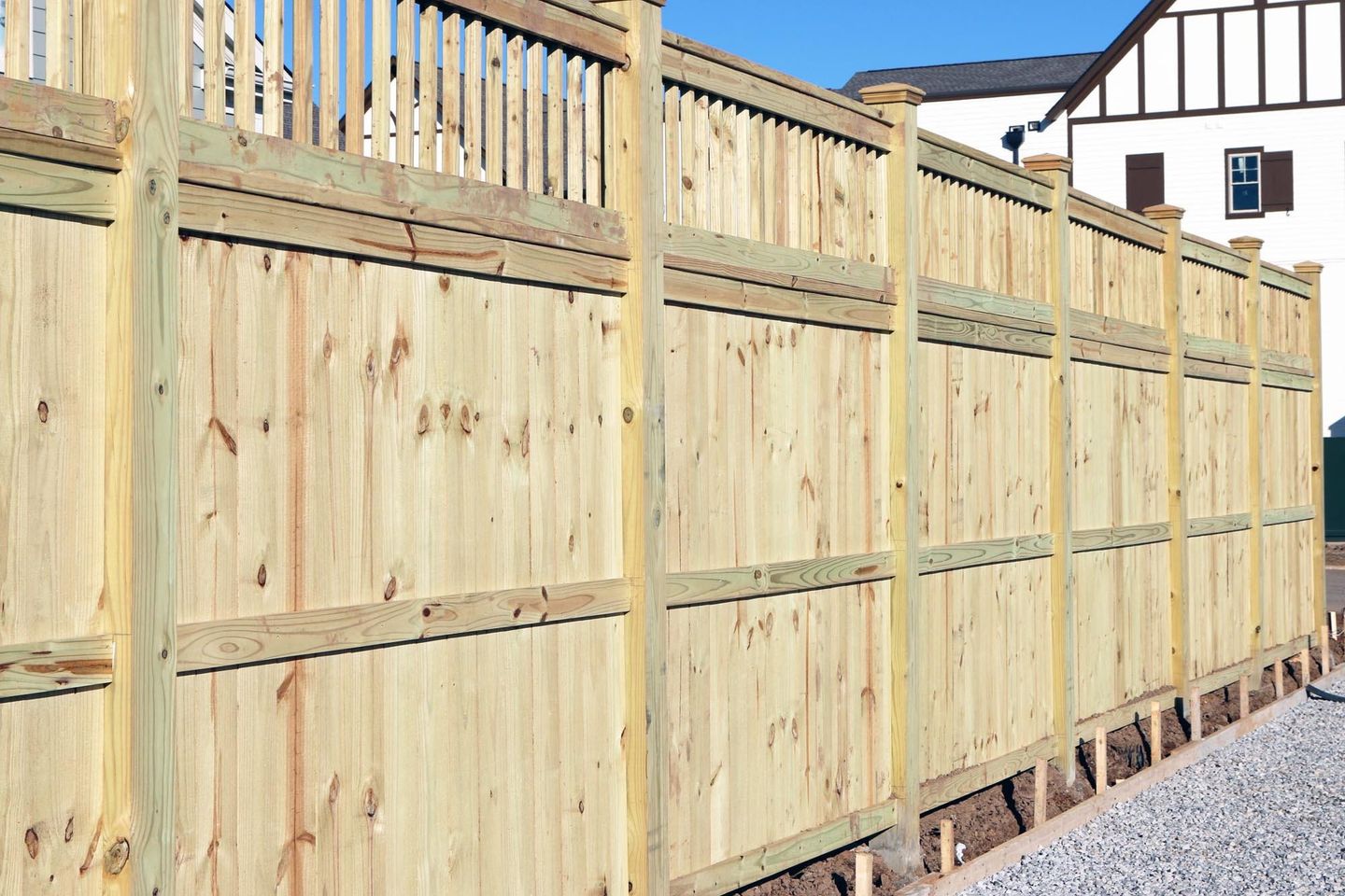 Quality white fence running along the customer property in Nelson