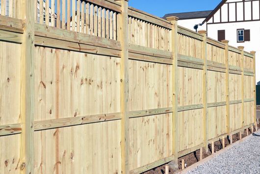 Quality white fence running along the customer property  in Nelson