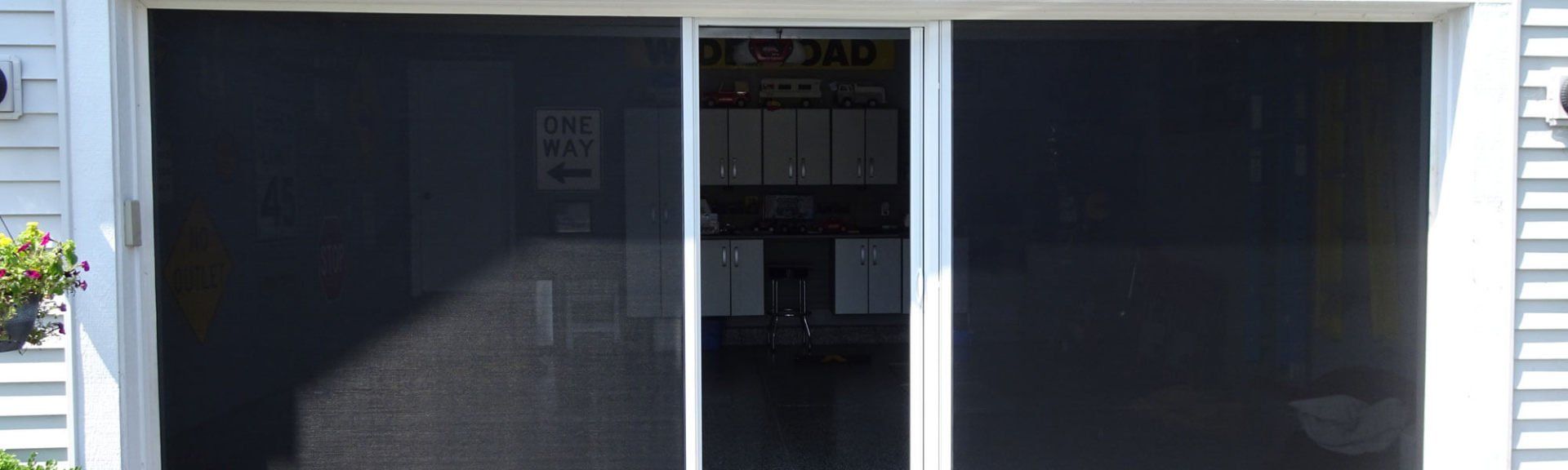 Three-panel sliding screen door.
