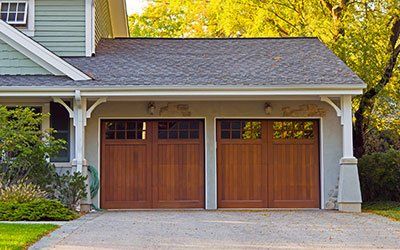 Two wooden garage doors. Two wooden garage doors.