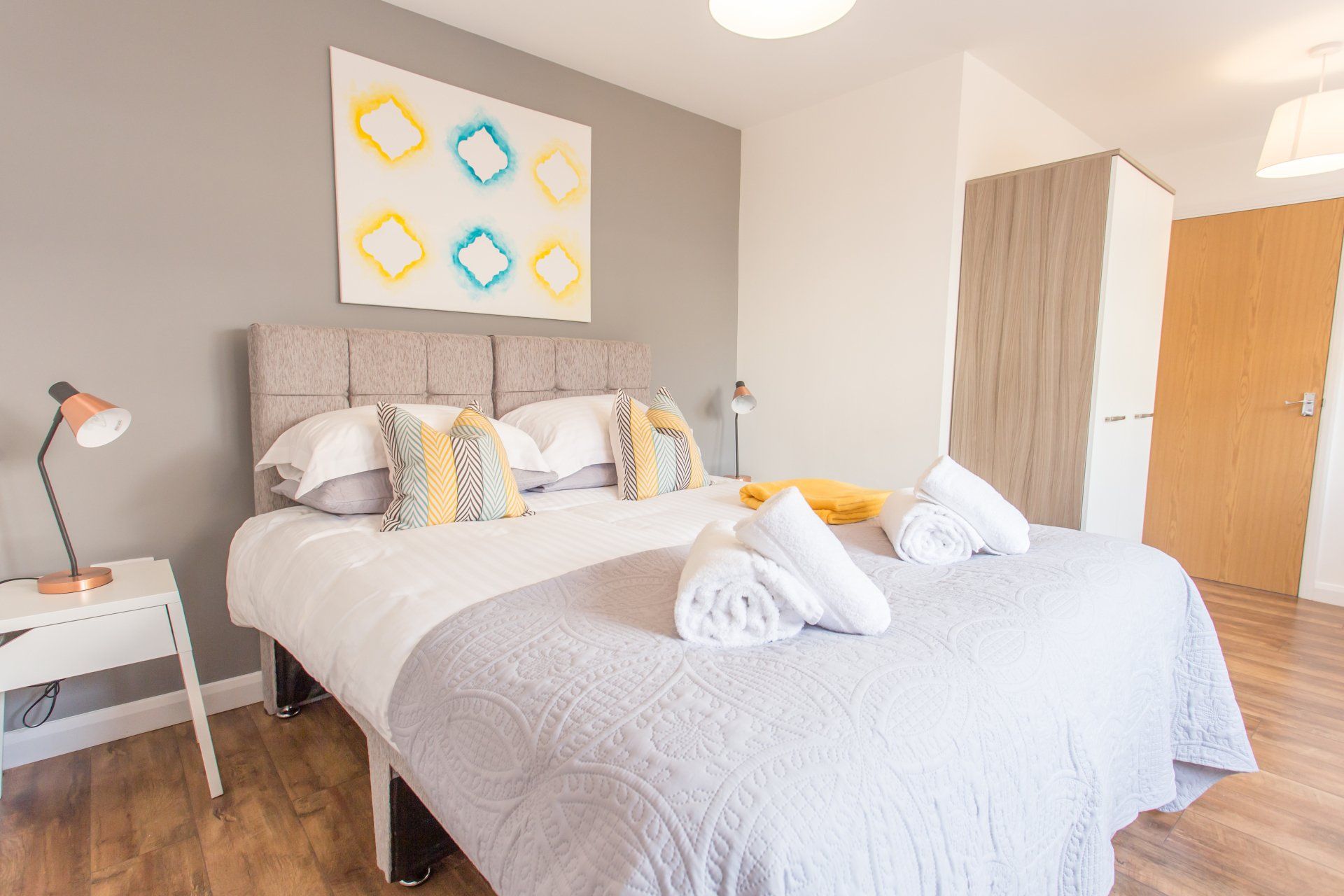Stylish interior with artwork, ambient lighting, and modern furniture.