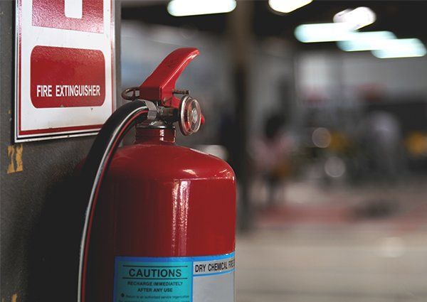Closeup Red Fire Extinguisher — Milwaukee, WI — Accurate Recharge and Fire Suppression Closeup Red Fire Extinguisher — Milwaukee, WI — Accurate Recharge and Fire Suppression