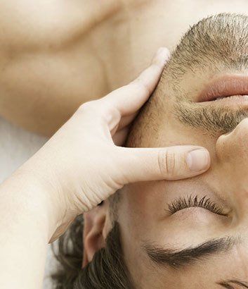 man having a facial massage male beauty treatment