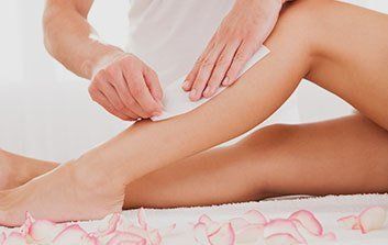Woman having waxing done