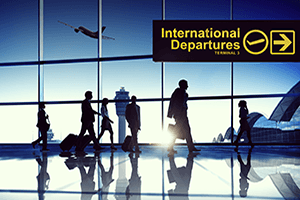 Woman leaving travels from there with her luggage