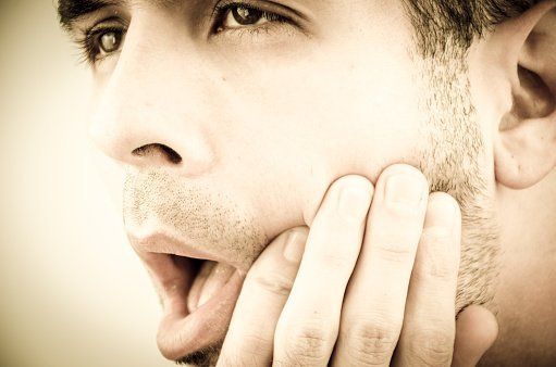 Cleaning man with toothache