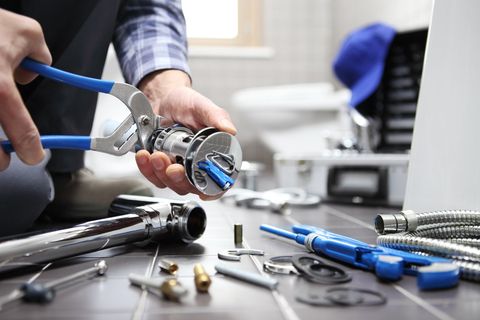 Plumber Working In A Bathroom — Campbell’s Complete Plumbing in Tamworth, NSW Plumber Working In A Bathroom — Campbell’s Complete Plumbing in Tamworth, NSW