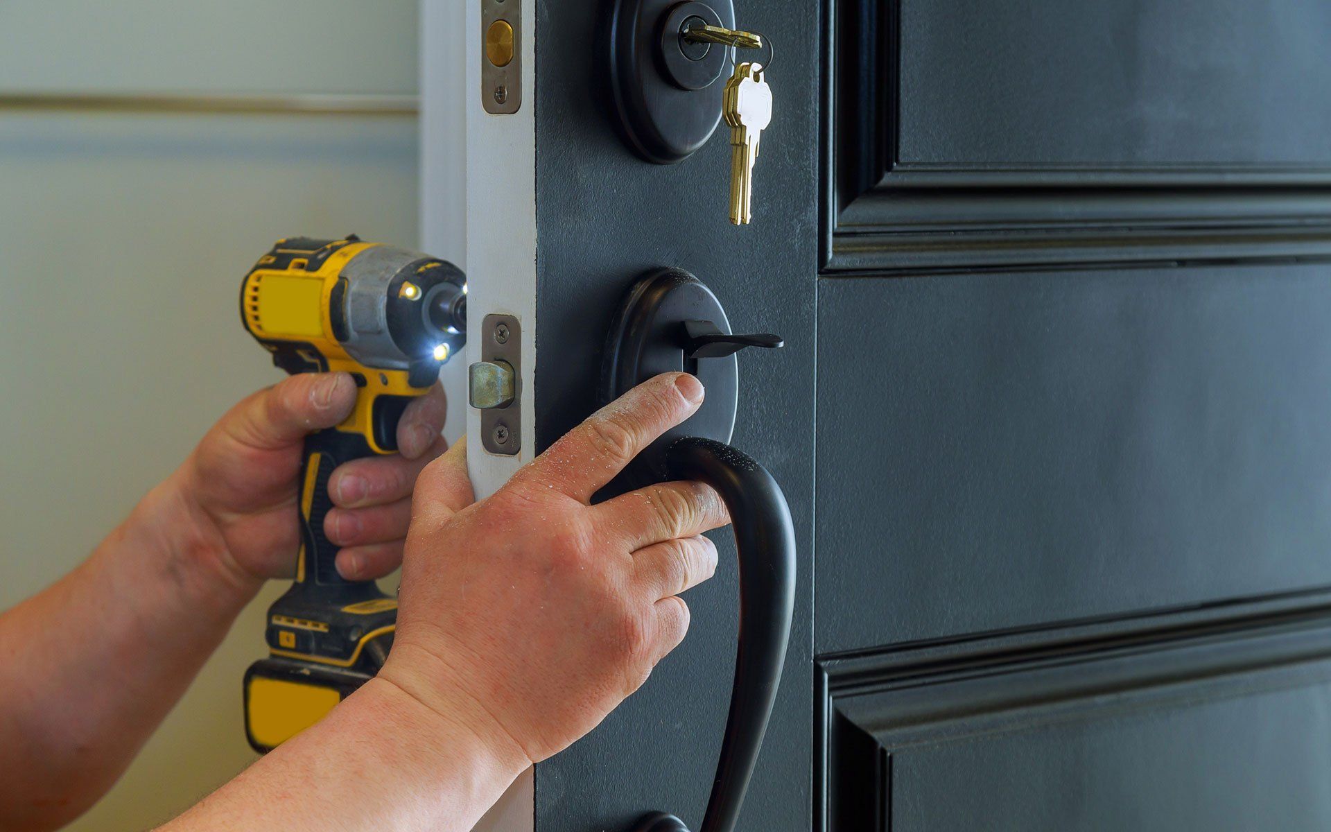 Exterior Doors — Staff Repairing Entrance Door in Pittsburg, PA