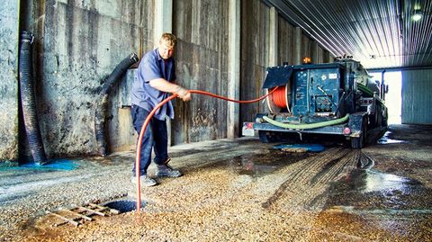 Man Hydro Jetting the Sewer — Clyman, WI — United Septic & Drain Services Inc Man Hydro Jetting the Sewer — Clyman, WI — United Septic & Drain Services Inc