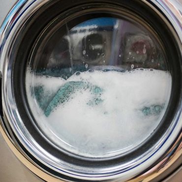 Home Appliances — Clothes Being Washed Inside a Washer in Bountiful, UT Home Appliances — Clothes Being Washed Inside a Washer in Bountiful, UT