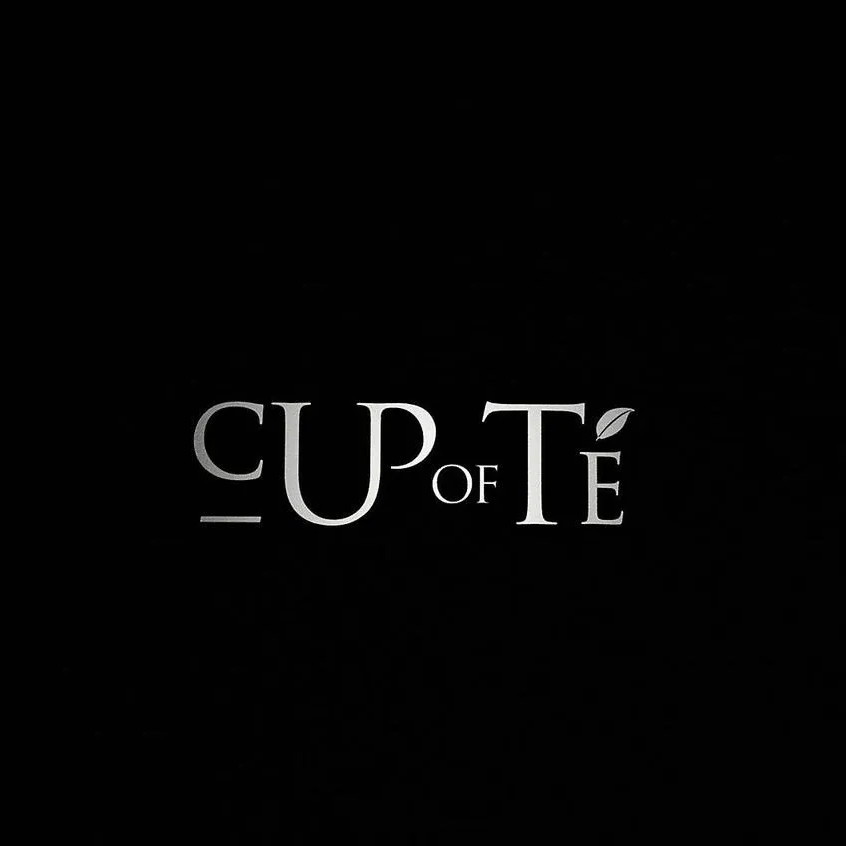 A cup of tea logo on a black background.