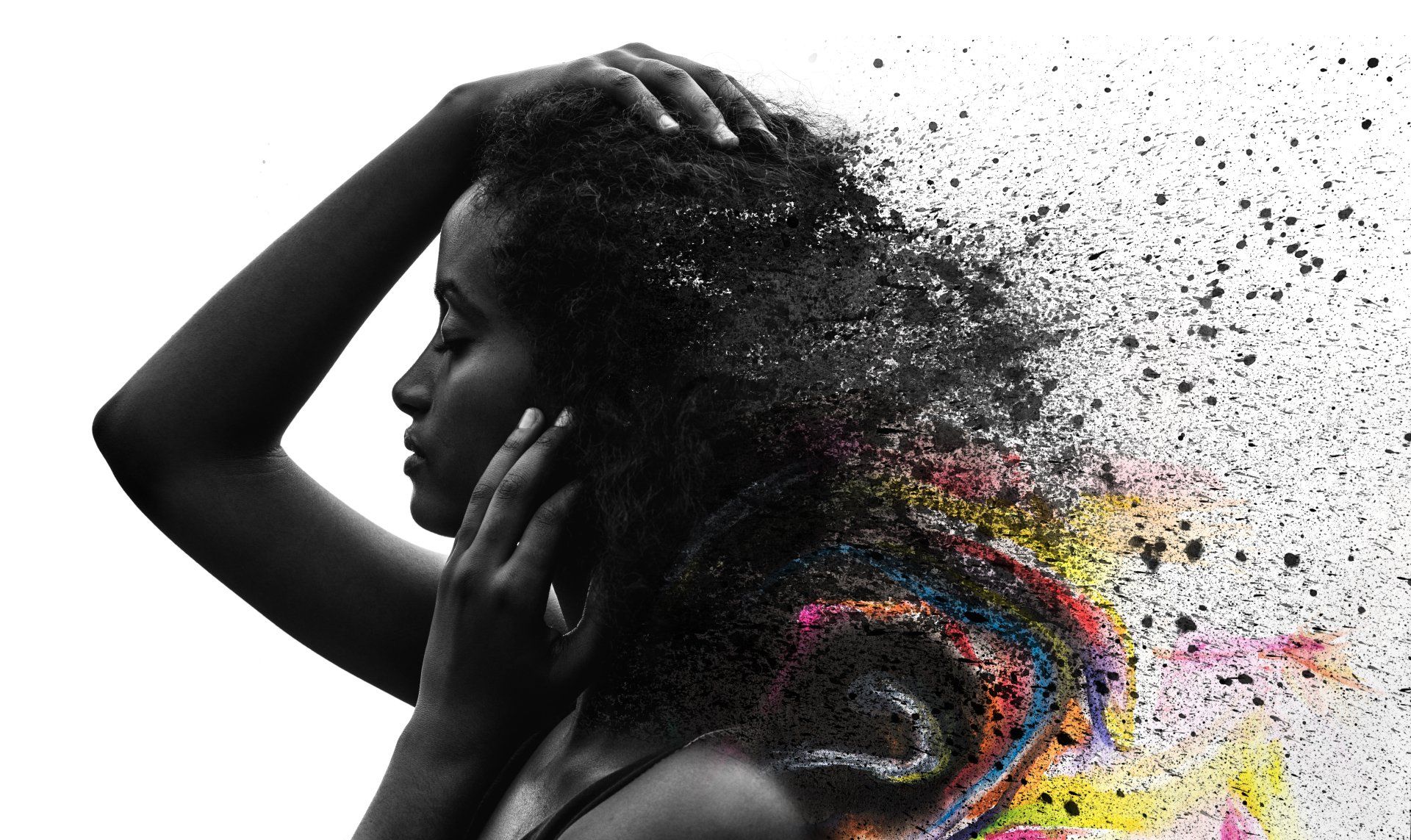 A black and white photo of a woman with colorful hair coming out of her head.