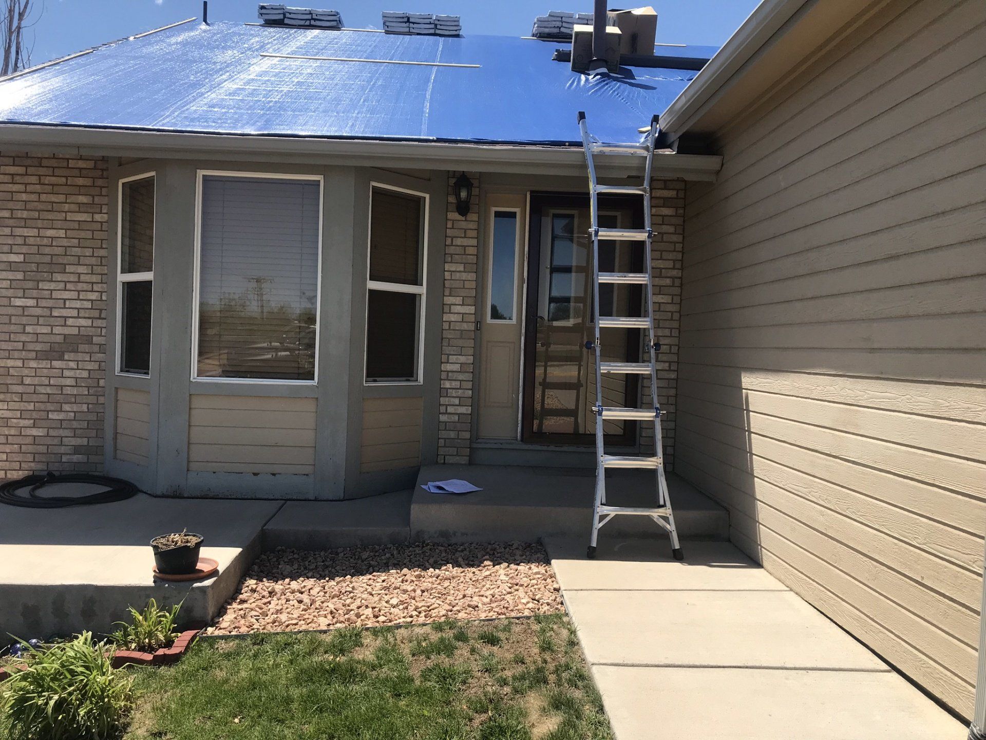 A house with a ladder on the front of it