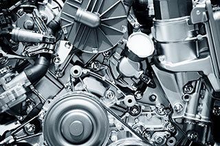 A close up of a motorcycle engine with a lot of parts.
