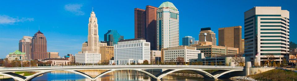 Columbus downtown skyline and bridge with mirror-like reflection
