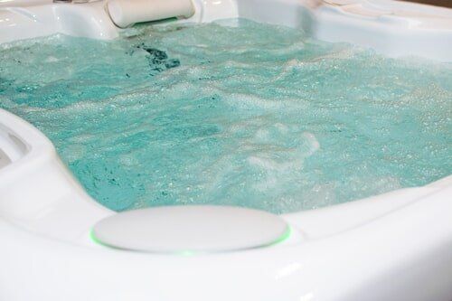Hot Tubs — White Tub Filled with Hot Water in Manchester, CT Hot Tubs — White Tub Filled with Hot Water in Manchester, CT