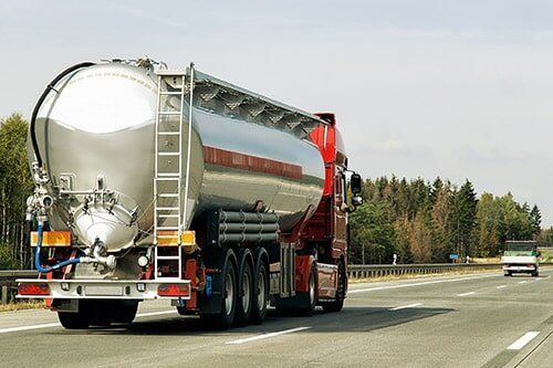 Water Tanker — Truck with Big Water Tank in the Highway in Manchester, CT Water Tanker — Truck with Big Water Tank in the Highway in Manchester, CT