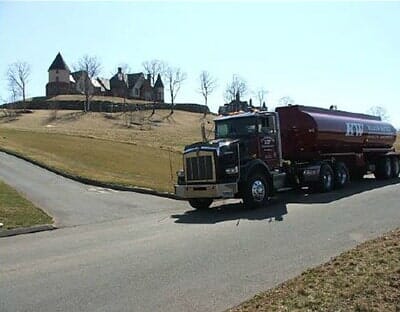 Red Water Truck On Move — Flooding Foundation in Manchester, CT