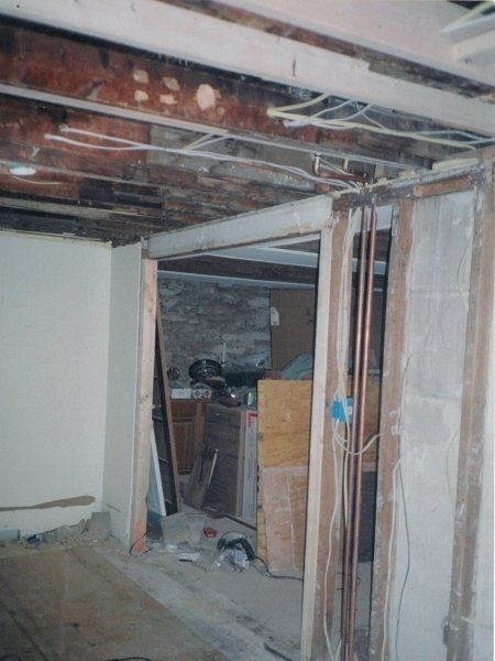 A room with a lot of wires hanging from the ceiling
