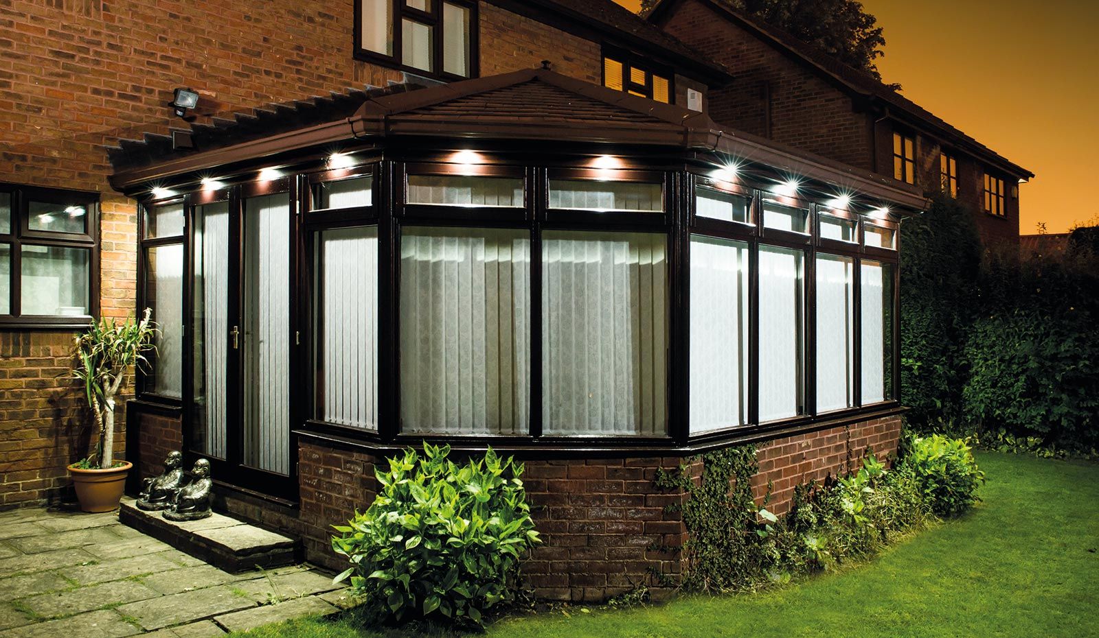 Victorian Conservatory at night Featuring bespoke lighting
