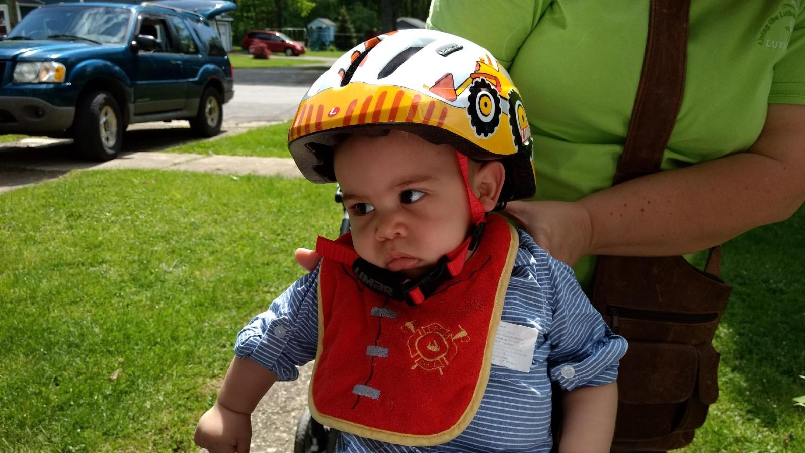 a baby wearing a helmet