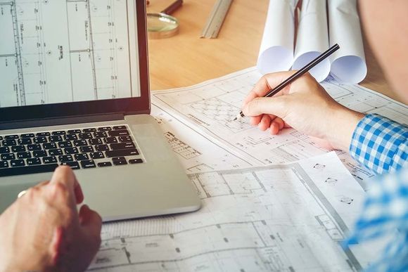 man checking the construction plans