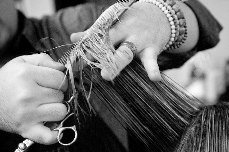 Black and white of Ken cutting hair