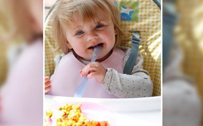 a small girl eating
