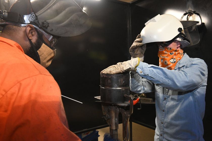 Local 538 Apprentices working together on a pipefitting job