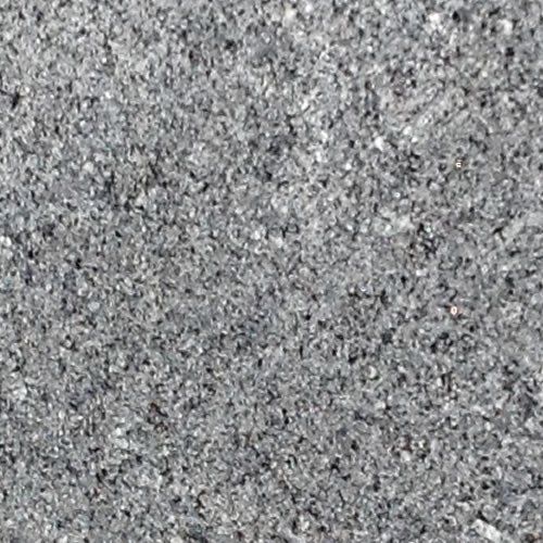 A close-up texture of gray and black speckled granite stone.