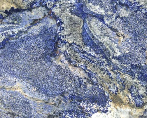 Abstract texture of swirling blue, white, and gray mineral patterns resembling polished stone or marble.