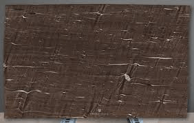 A slab of brown polished stone with a textured, linear pattern of lighter, horizontal and diagonal fissures.