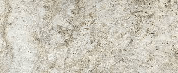 A close-up of a neutral-toned, speckled stone surface with a marbled, organic texture.