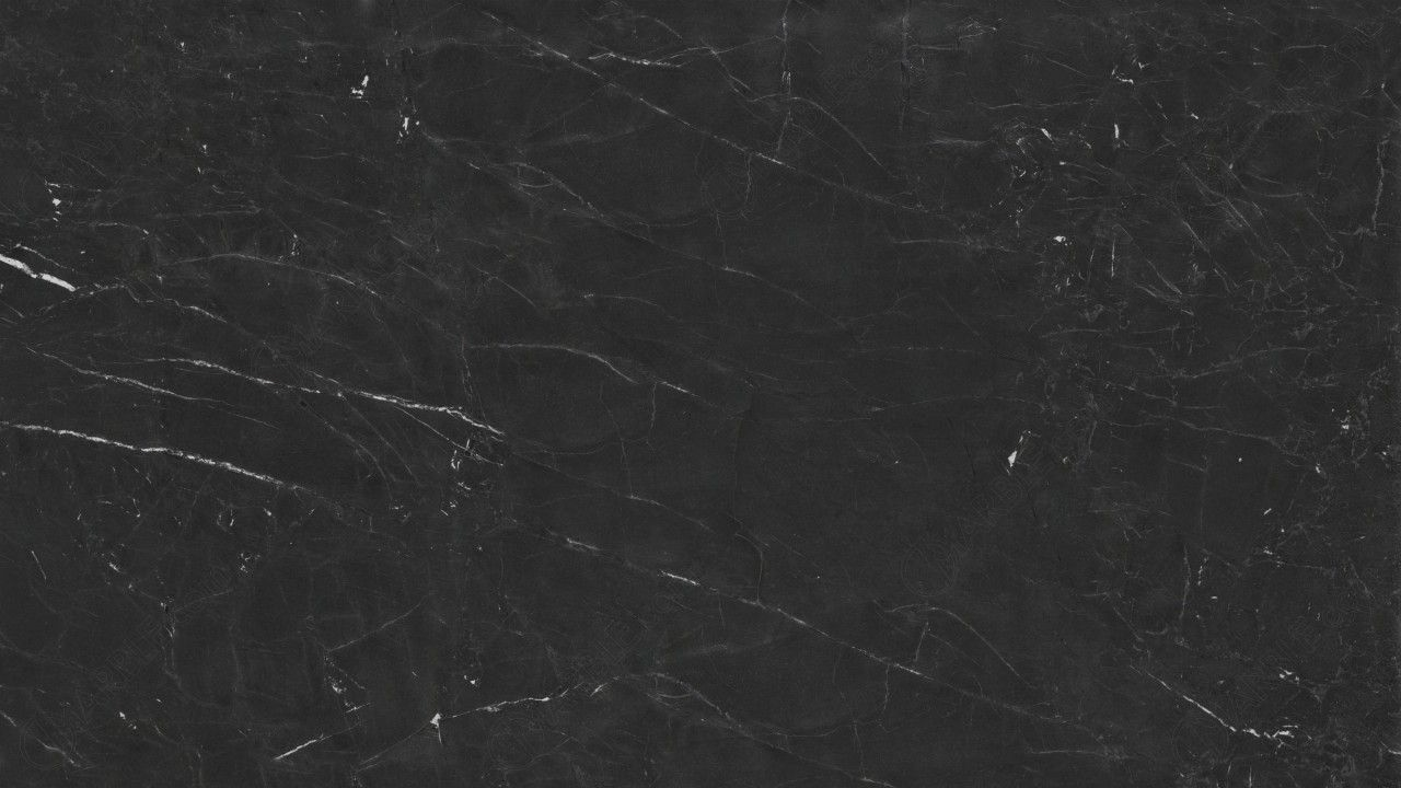 Dark gray stone texture with thin, white, branching vein patterns.