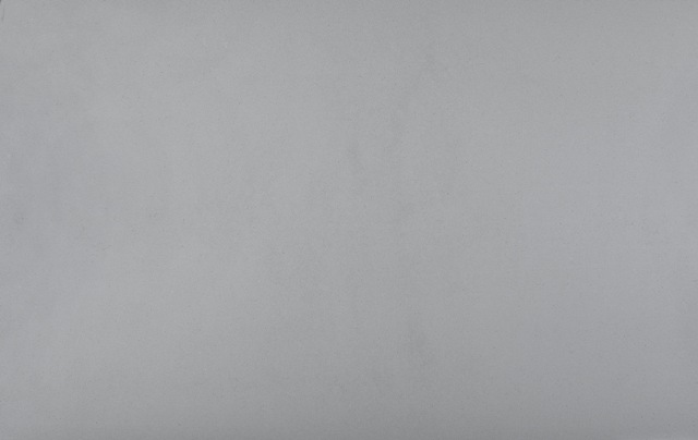 A smooth, uniform, light-gray textured surface.