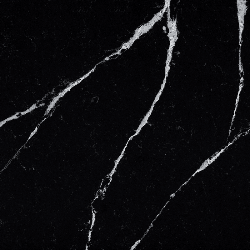 Black marble texture with prominent, thin white veins running diagonally across the dark surface.