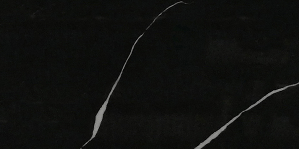 Black stone texture with two prominent, thin white marble veining lines running diagonally across the surface.