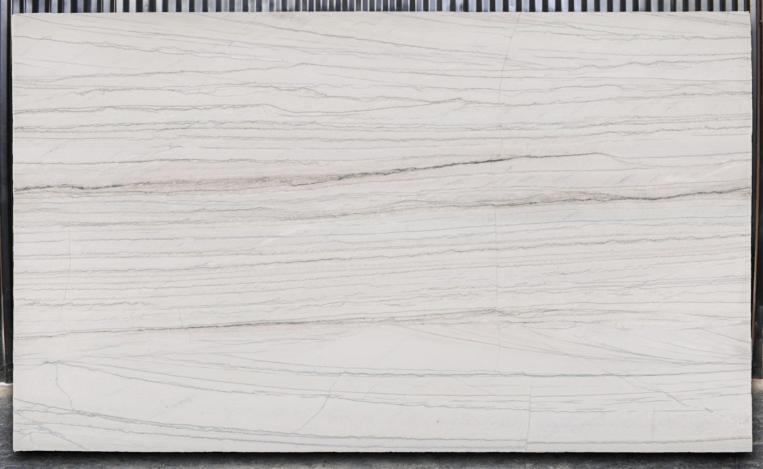 A rectangular slab of light-gray stone with linear, dark-gray wood-grain-like patterns.