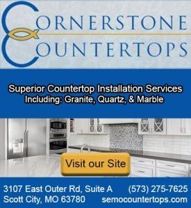 An advertisement for Cornerstone Countertops featuring their services, contact information, and a kitchen photo.